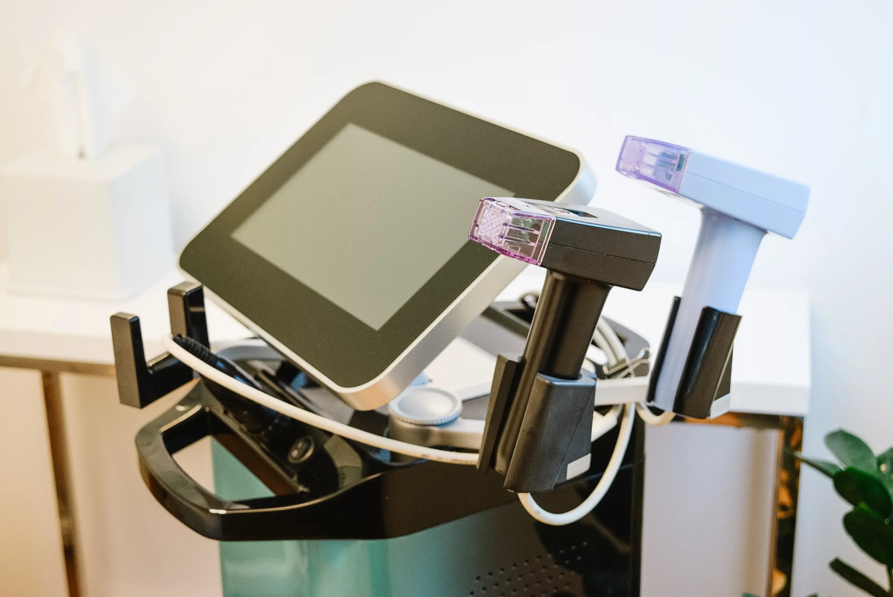 morpheus8-device-with-touchscreen-and-two-handpieces-on-a-clinic-stand-showing-what-is-morpheus8-equipment-in-a-clean-treatment-room